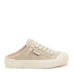 A single low-top slip-on sneaker in a light beige suede-like material with matching laces, a thick textured sole, and a small side tab displaying the 'supra' brand logo, set against a plain white background.