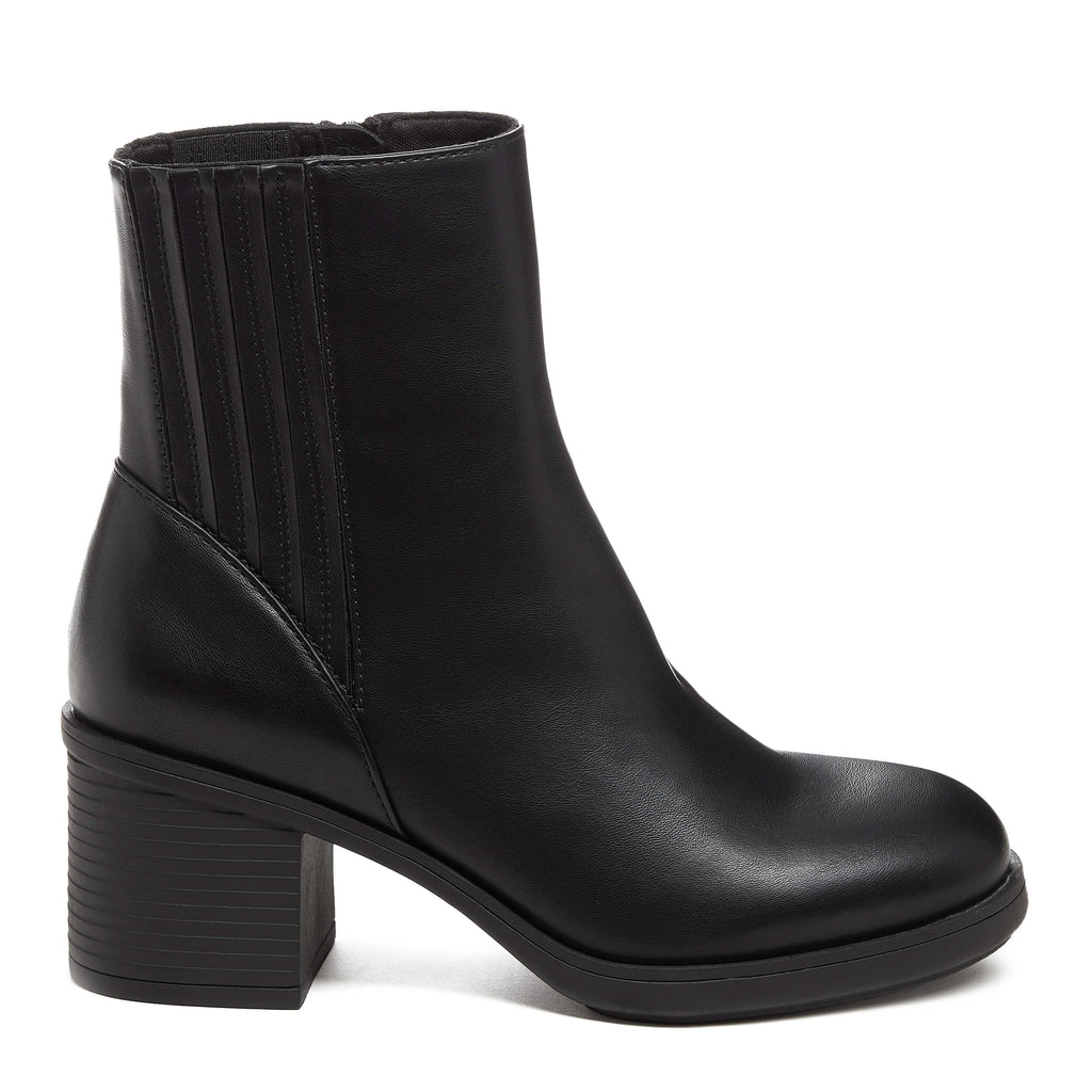 A black faux leather Chelsea boot with a chunky heel and platform sole, featuring a zipper closure.