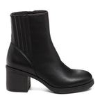 A black faux leather Chelsea boot with a chunky heel and platform sole, featuring a zipper closure.