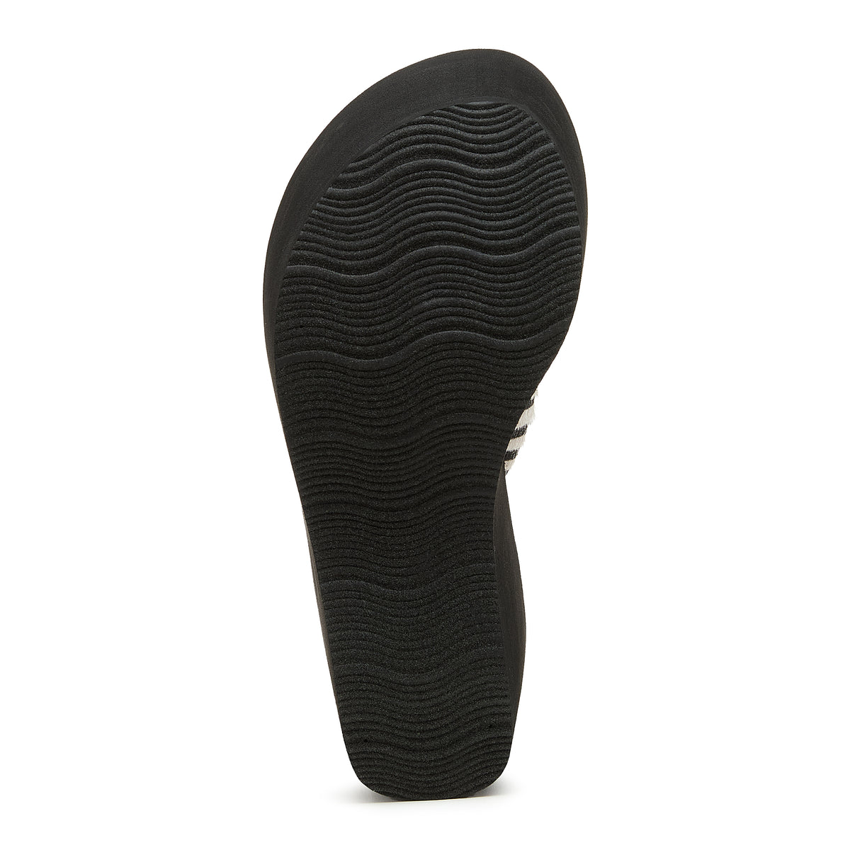 Black outsole of the Rocket Dog Crush tan animal print flip flop