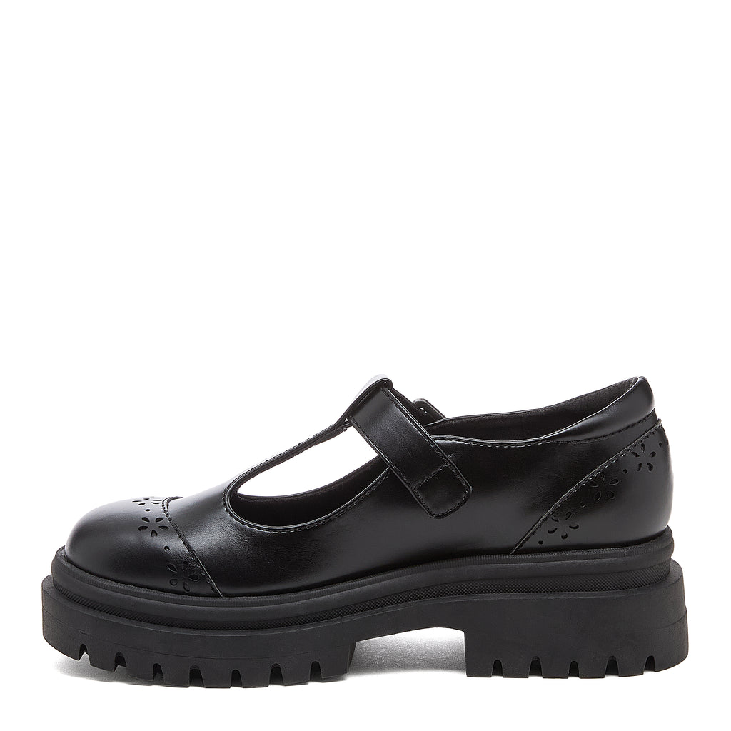 Image 1: Dalma Black Chunky Mary Jane Shoes in black, side view showing T-bar front, flower cut-outs and chunky sole