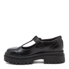 Image 1: Dalma Black Chunky Mary Jane Shoes in black, side view showing T-bar front, flower cut-outs and chunky sole