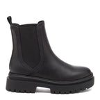 Drake Black Boots black boots outer side view showing Chelsea boot shape, side elastic panel, back pull tab and chunky treaded sole