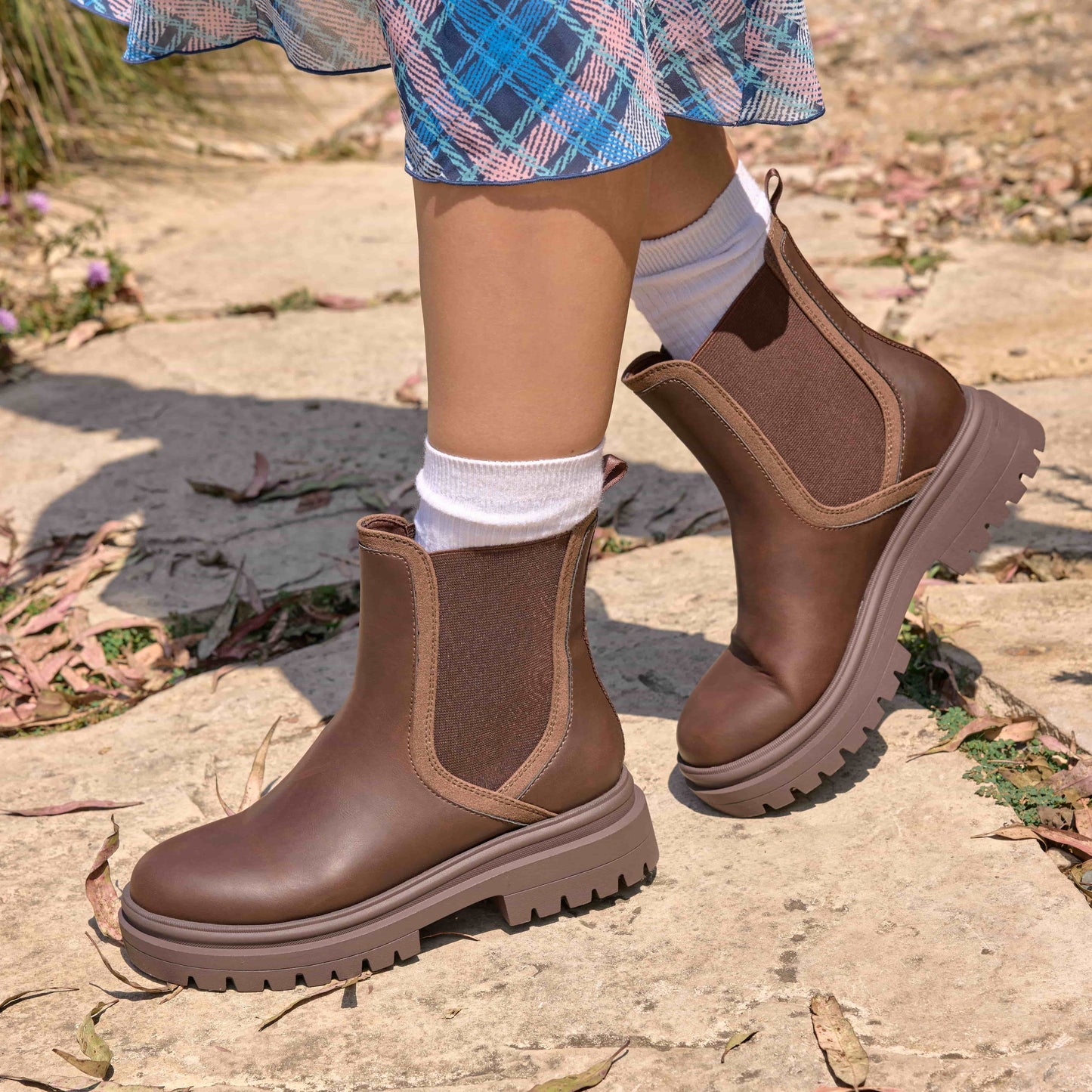 Drake Dark Brown Boots worn outdoors with dress hem, white socks and side panels visible