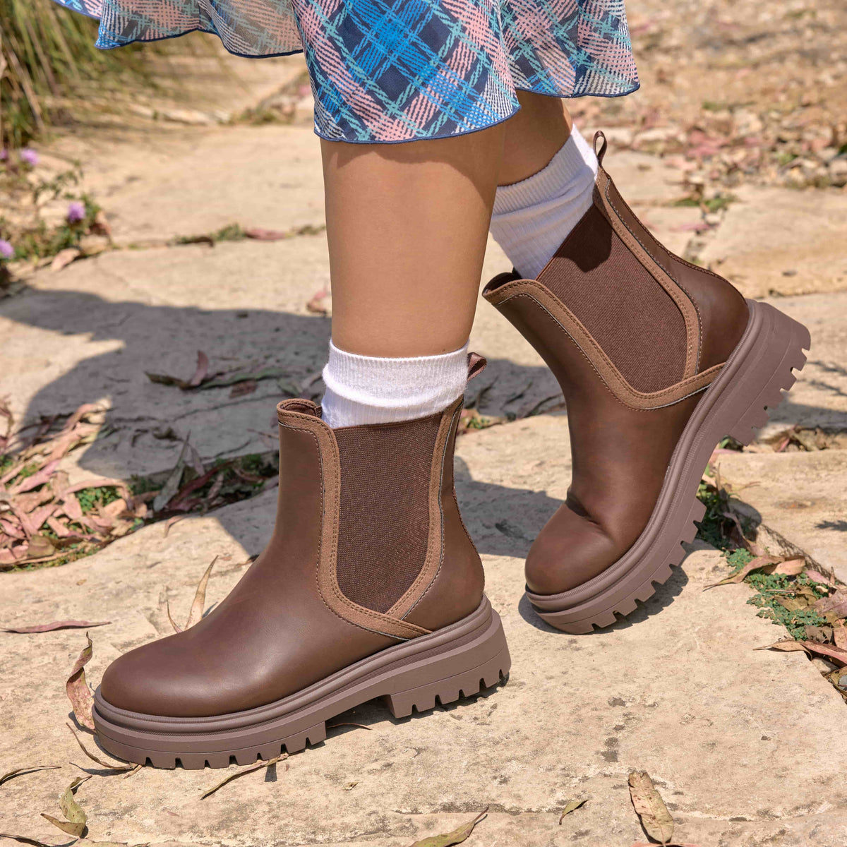 Drake Dark Brown Boots worn outdoors with dress hem, white socks and side panels visible
