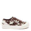 Side view of the Rocket Dog Jazzin Plus brown cow print trainer, brown and white cow print canvas