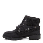 Nixie Black Boots in black, side profile showing ankle boot shape, textured cuff, side lace detail and treaded sole.