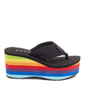 Side view of the Rocket Dog Crush Rainbow platform flip flop, black webbing strap on a rainbow striped platform