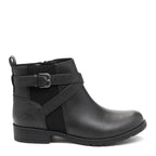 A black ankle boot with a buckle strap detail on the upper, synthetic leather material, with a flat sole and inside zip closure.